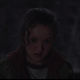 Ellie staring at something offscreen, fixated, in a scene from HBO's The Last of Us.